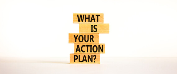 Action plan symbol. Concept words What is your action plan on wooden blocks. Beautiful white table white background. Business What is your action plan concept. Copy space.