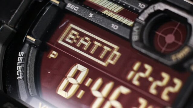 Macro close up of a tactical digital watch face functioning
