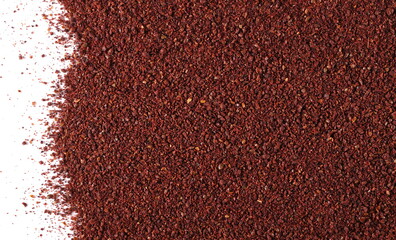 Ground sumac spice, pile isolated on white, top view 