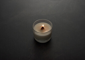 Obraz na płótnie Canvas burning candle on a dark background
