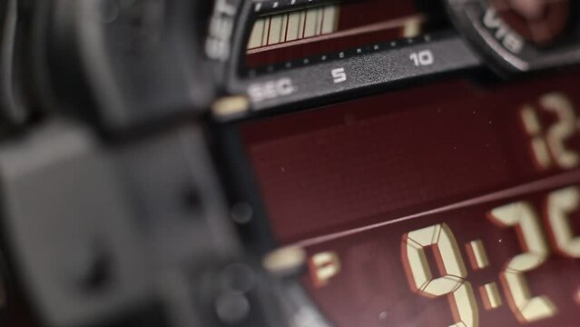 Macro close up of a tactical digital watch face functioning
