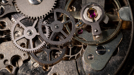 Clockwork, hand wind up watch mechanism - close up macro, showing mechanical movements - gears,...