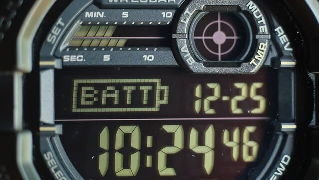 Macro close up of a tactical digital watch face functioning
