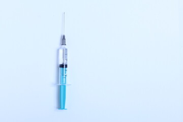 Medical syringe on a white background. A syringe for injection. The concept of health and beauty