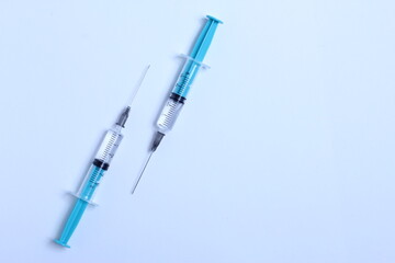 Medical syringe on a white background. A syringe for injection. The concept of health and beauty