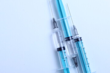 Medical syringe on a white background. A syringe for injection. The concept of health and beauty