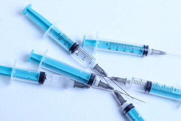 Medical syringe on a white background. A syringe for injection. The concept of health and beauty