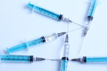 Medical syringe on a white background. A syringe for injection. The concept of health and beauty