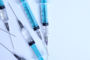 Medical syringe on a white background. A syringe for injection. The concept of health and beauty