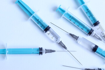 Medical syringe on a white background. A syringe for injection. The concept of health and beauty