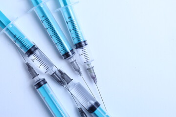 Medical syringe on a white background. A syringe for injection. The concept of health and beauty