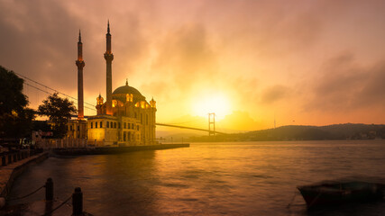 A beautiful sunrise at Ortakoy mosque and Bosphorus bridge. Ortakoy is one of the most popular...