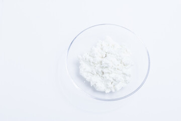 cottage cheese in a glass transparent bowl isolated on a white background