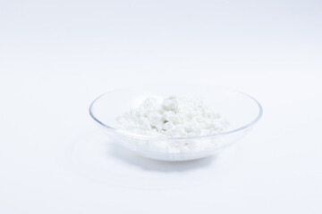 cottage cheese in a glass transparent bowl isolated on a white background