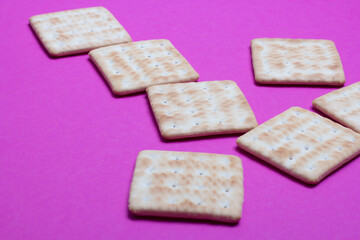 cracker cookies on a pink background
