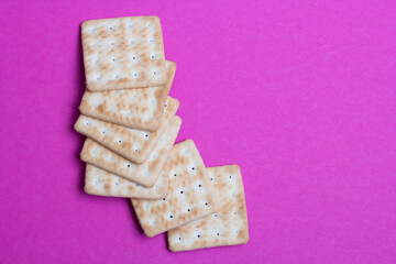 cracker cookies on a pink background