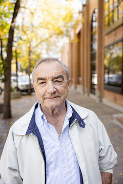 Portrait Confident Senior Man On Sidewalk