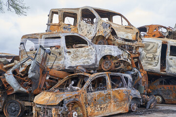 2022 Russian invasion of Ukraine war. War ruins city damage car. Terror attack bomb shell of...