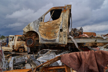 2022 Russian invasion of Ukraine war. War ruins city damage car. Terror attack bomb shell of...