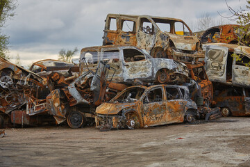 2022 Russian invasion of Ukraine war. War ruins city damage car. Terror attack bomb shell of...