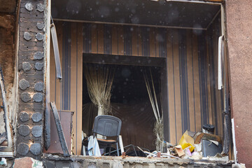 War of Russia against Ukraine. Residential building damaged by enemy aircraft in Ukrainian. Consequences of war, damaged grocery market by troops of Russian army. private house destroyed.