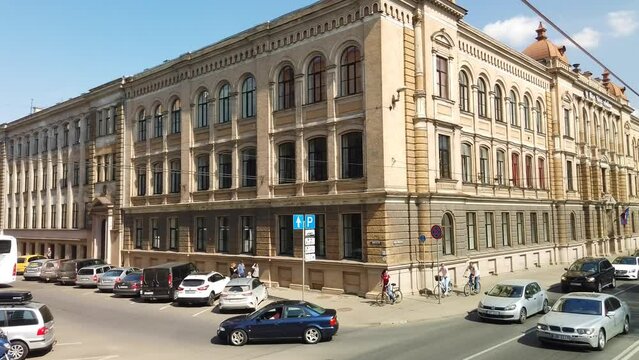 On board a bus in Riga, travelling through sunny streets.
