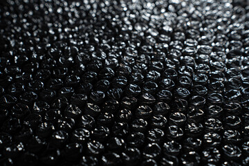 Black Bubble Wrap Close Up Background at an Angle