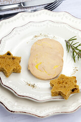 Slices of foie gras on a plate with gingerbread