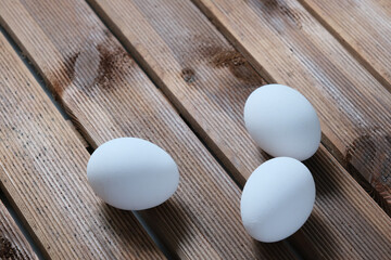 white eggs on wooden table