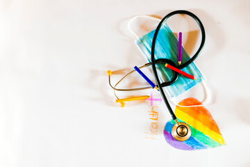 stethoscope placed on a colored rainbow heart