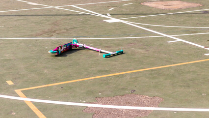 Shot of colorful girl' scooters on playground's floor. Concept