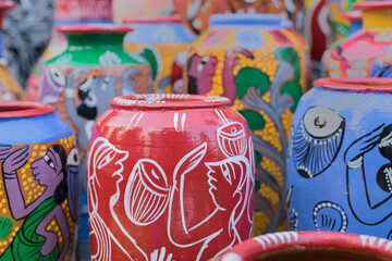 Fototapeta na wymiar Bright colorful terracotta pots, works of handicraft, on display during Handicraft Fair in Kolkata - the biggest handicrafts fair in Asia.