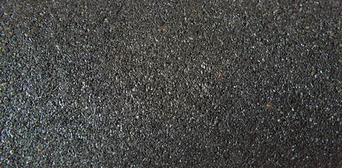 Charcoal textured background. Coal water filter close up. Selective focus