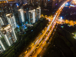 Fototapeta na wymiar Aerial photography of modern residential buildings and urban roads in China at night