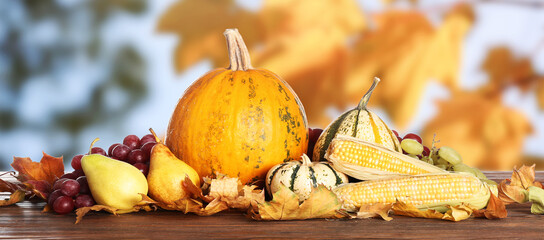 Heap of gathered harvest on table in autumn garden