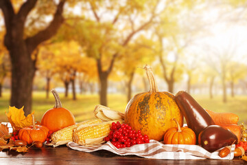 Heap of gathered harvest on table in autumn garden