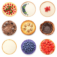 Set of delicious cheesecakes on white background, top view