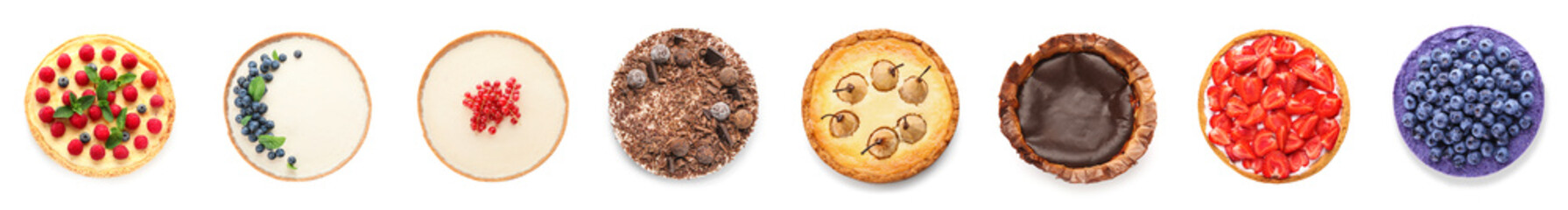 Set of delicious cheesecakes on white background, top view