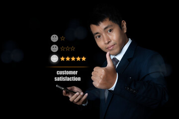 Businessman hand use smartphone choosing screen on five star icon to give satisfaction in service rating very impressed.