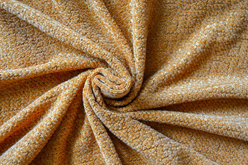 Closeup texture of knitted fabric beige color for background, top view. Fabric textile background