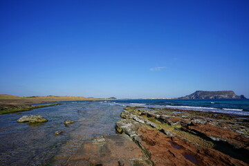 moss rock beach and clear water