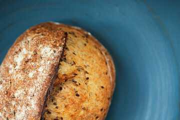 Homemade wheat bread with flax seeds. The concept of homemade bread and healthy food. Top view. Flat lay.