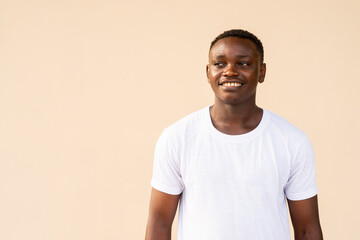 Obraz premium Portrait of handsome African man wearing white t-shirt