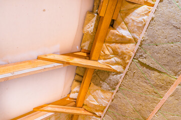 The process of roof insulation with glass wool and mineral wool