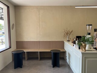 green tree pot in corner of many modern minimal style cafe interior