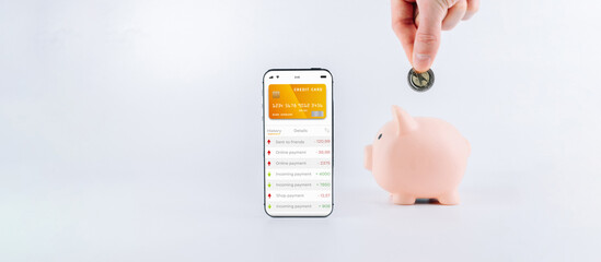 Mobile banking. Smartphone with internet online bank application. Piggy bank with usd money cash on...
