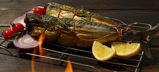 Concept of tasty food with smoked mackerel on wooden table