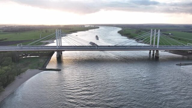 Road surface and traffic on Tacitusbrug bij Ewijk modern suspension bridge crossing the river Waal near Nijmegen, the Netherlands Holland Europe. Valburg and Ewijk.