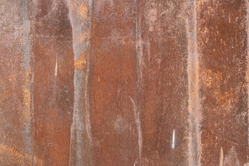 A stone wall with old paint of rough texture and cracks close-up. Background for designers.