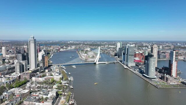 Rotterdam city skyline in The Netherlands drone view of the Maas and office buildings city view. Destination in Holland. Erasmusbrug and river Maas urban city view.